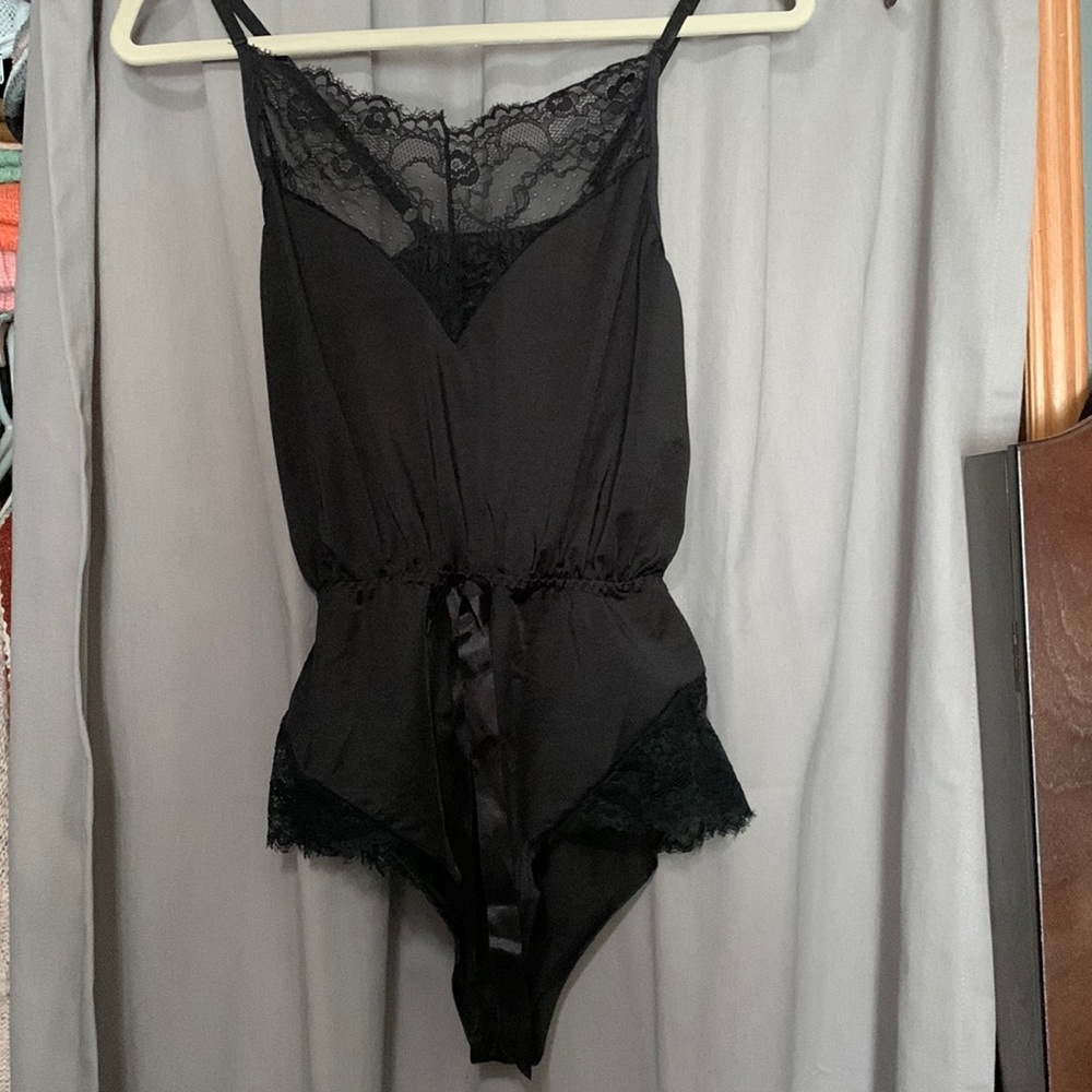 Black sleep romper. Super cute worn once. Fits like a small.